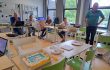 viertal mensen achter laptop test OKE koppeling bij mboRijnland in Gouda